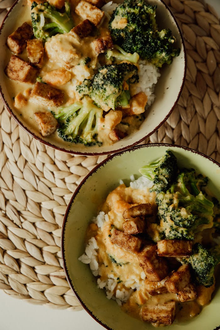 Delicious and creamy tofu and broccoli rice bowls served warm with a touch of spice.